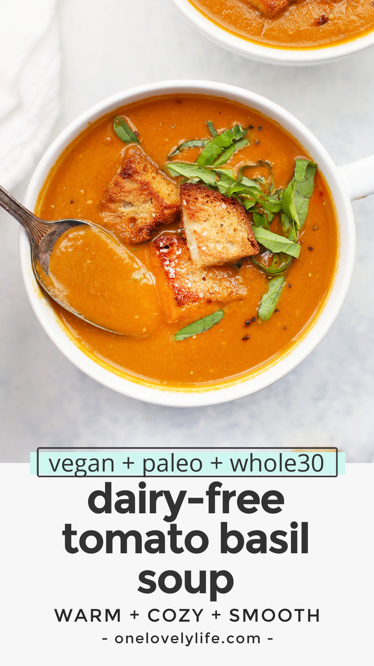 Creamy Tomato Basil Soup - You'd never guess that this creamy tomato soup is 100% vegan. It's full of deep, rich tomato basil flavor and a gorgeous velvety texture you'll fall for over and over again. (Vegan & Paleo) // Roasted Tomato Basil Soup Recipe // Paleo Tomato Basil Soup // Vegan Tomato Basil Soup #tomatosoup #vegan #paleo #dairyfree