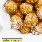 Overhead view of a bowl of lemon energy bites on a white background with text overlay that reads "paleo + vegan lemon energy bites"