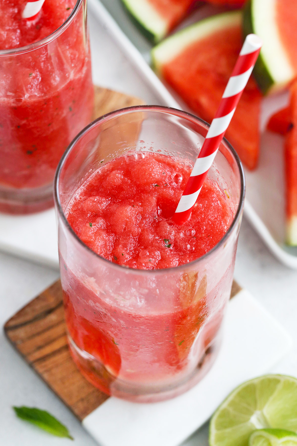 Watermelon Slushies in Glasses with Red and White Striped Straws