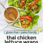Overhead view of Thai chicken lettuce wraps drizzled with peanut sauce with text overlay that reads "gluten-free + paleo-friendly Thai Chicken Lettuce Wraps with the BEST Peanut Sauce"
