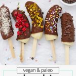 Overhead view of frozen chocolate covered bananas pops with different toppings