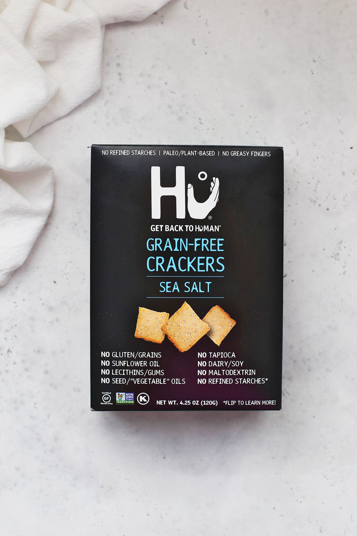 A box of Hu Kitchen Sea Salt Crackers on a white background