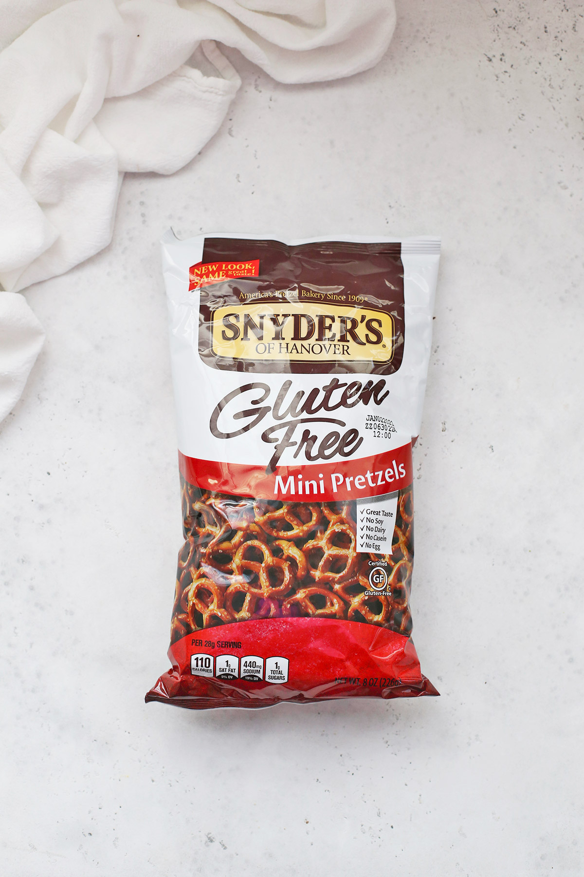 A bag of gluten-free Snyders pretzels on a white background