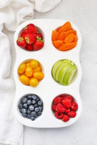 Rainbow Muffin Tin Snack Tray For Kids with Strawberries, Carrot Chips, Yellow Grape Tomatoes, Green Apple Slices, Blueberries, and Raspberries