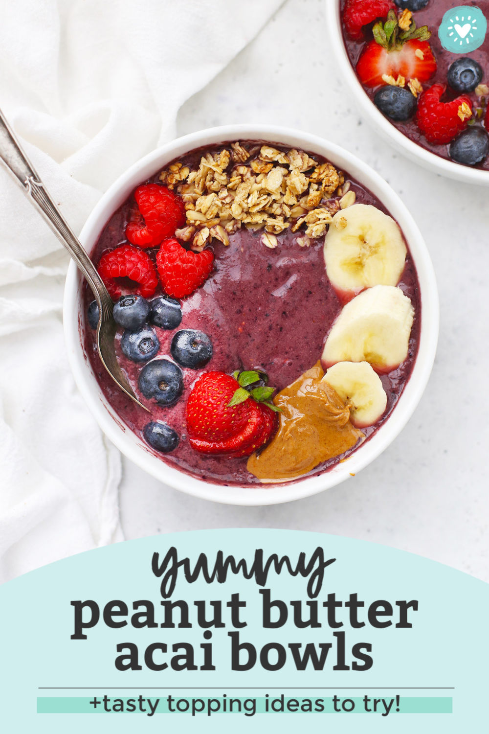 Peanut Butter Acai Bowl on a white background with a text overlay that reads "Yummy Peanut Butter Acai Bowls + Tasty Topping Ideas to Try!"