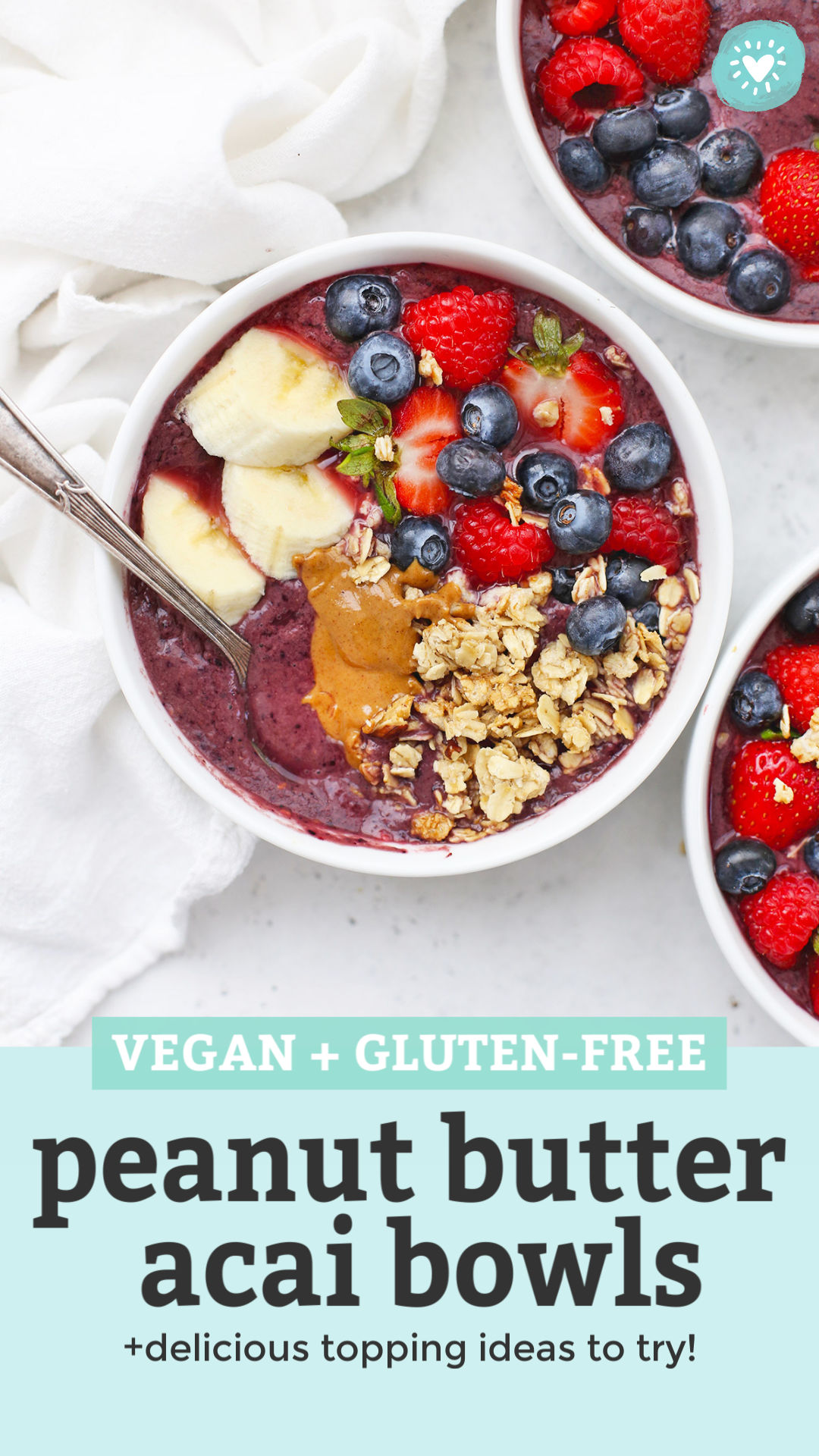 Peanut Butter Acai Bowls With Granola, fresh berries, peanut butter and banana with text overlay that reads "Vegan + Gluten-Free Peanut Butter Acai Bowls +Delicious Topping Ideas to Try!"