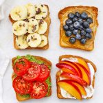 Four slices of gluten-free toast with different toppings on a white background.
