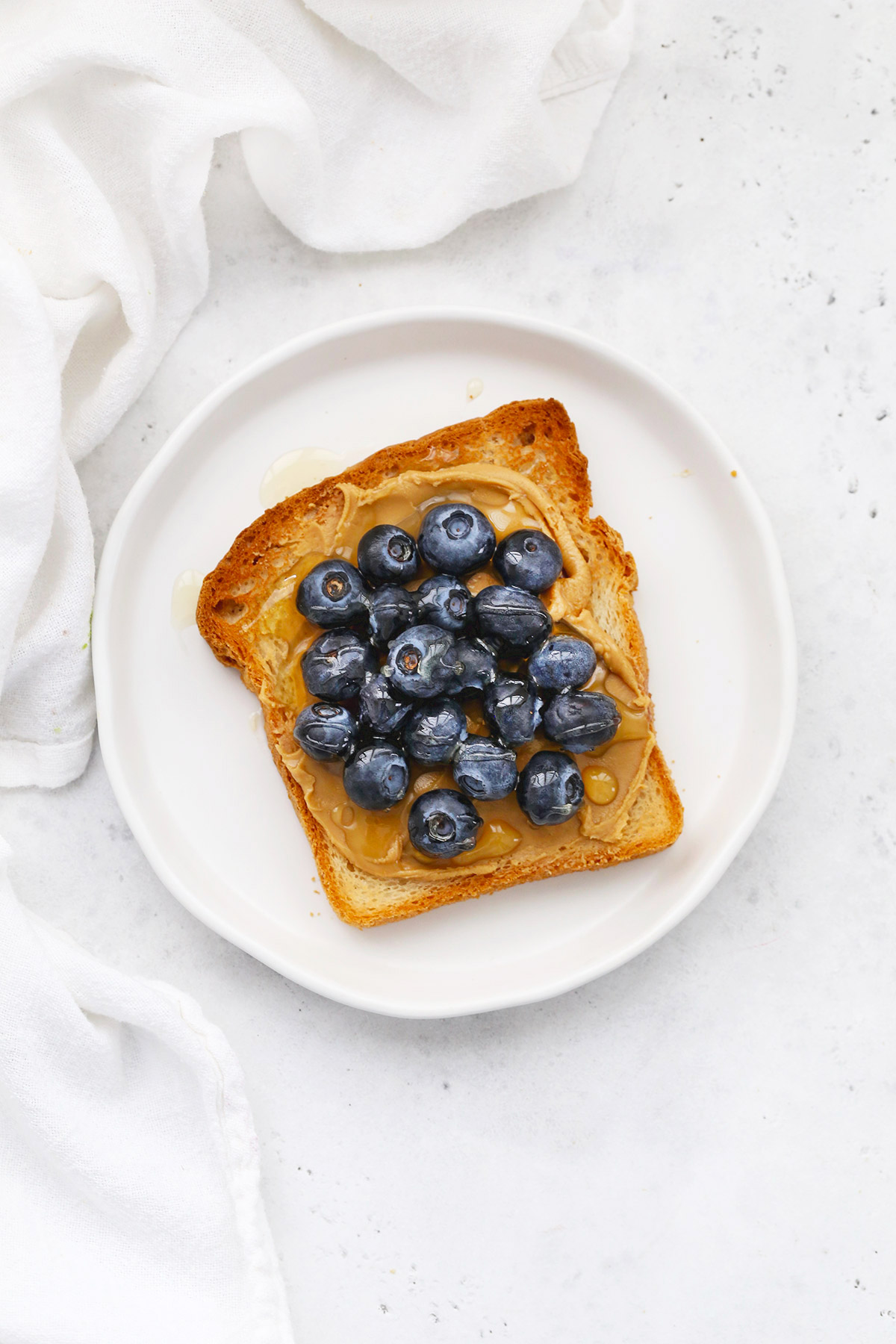 Gluten-Free Toast with Almond Butter, Blueberries, and Honey
