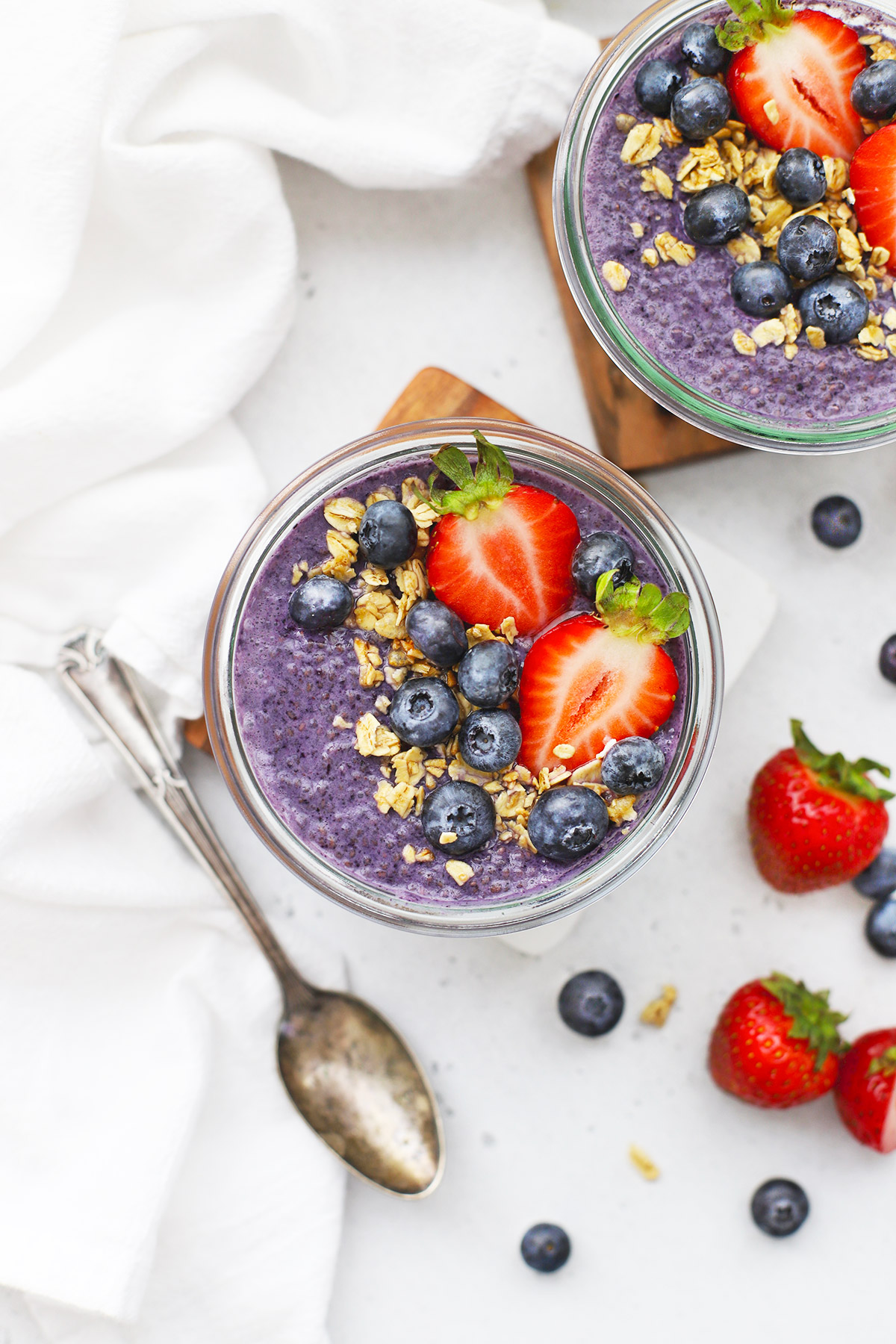 Blueberry chia pudding topped with fresh berries and granola.