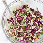 Close-up view of Cilantro Lime Slaw in a glass bowl