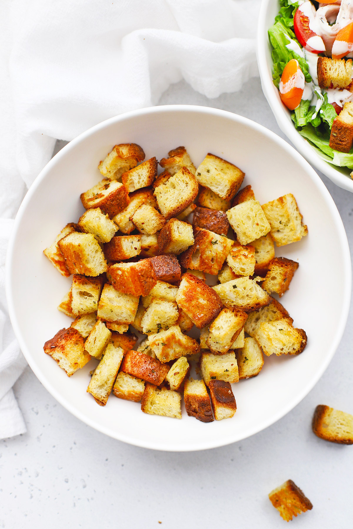 Gluten Free Croutons in a bowl next to salad