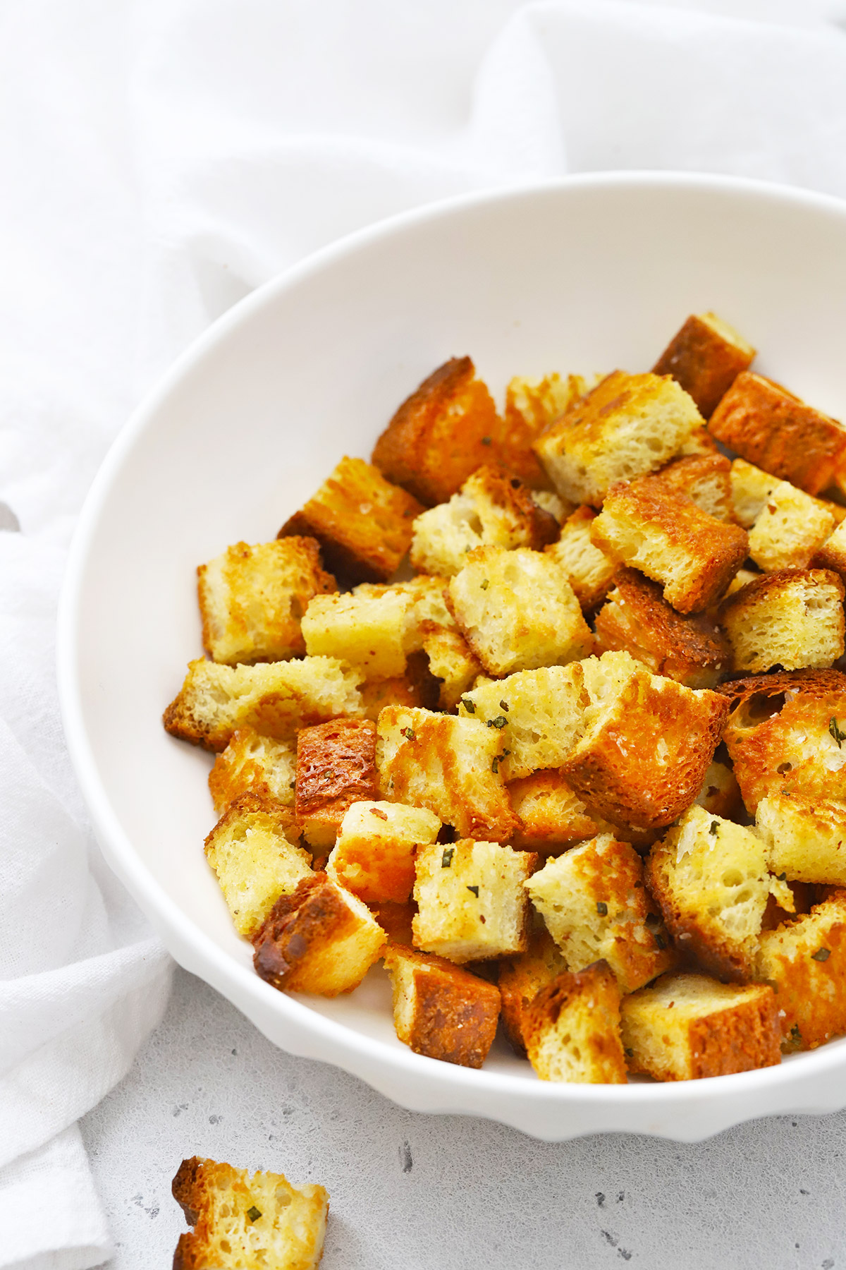 Front view of gluten-free croutons in a white bowl