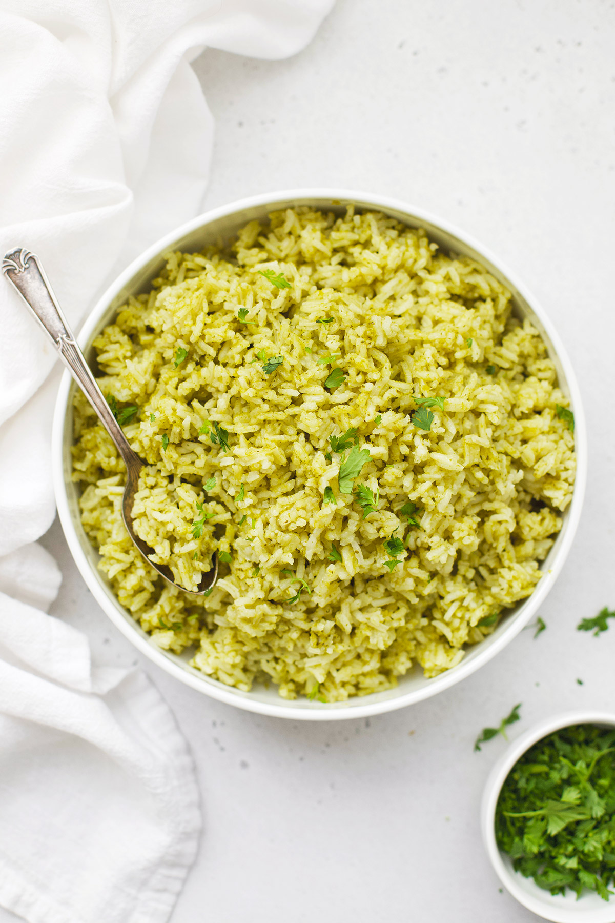 Mexican Green Rice (Arroz Verde) in a white bowl on a white background