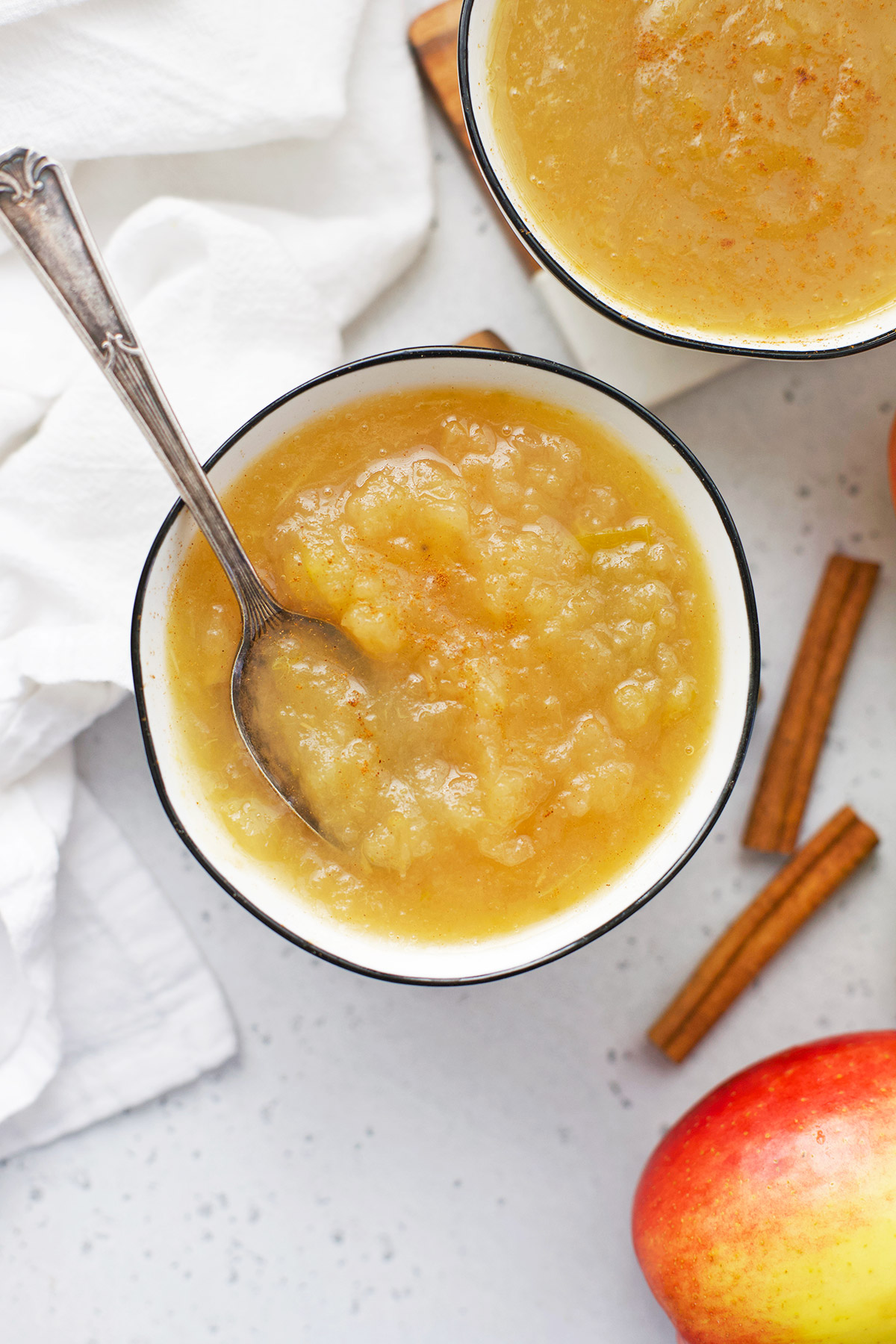 Two servings of Instant Pot Applesauce in white bowls