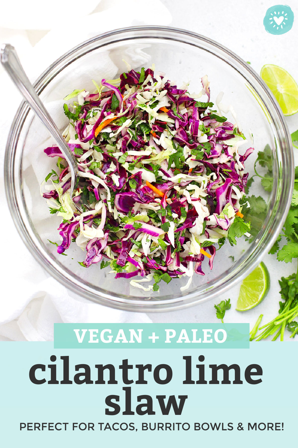 Cilantro Lime Slaw in a Glass Bowl with text overlay that reads "Vegan + Paleo Cilantro Lime Slaw. Perfect for tacos, burrito bowls, and more!"