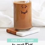 Chocolate Banana Monster Face Smoothie with a black and white stripe straw with text overlay that reads "Cute + Fun + Easy Monster Smoothies"