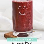 Blueberry Peach Smoothie in a glass with a monster face drawn on the glass with text overlay that reads "Cute + Fun + Easy Monster Smoothies"