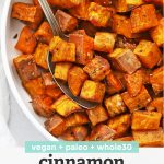 Overhead view of Cinnamon Rosemary Sweet Potatoes in a white bowl on a white background with text overlay that reads "Vegan + Paleo + Whole30 Cinnamon Rosemary Sweet Potatoes"
