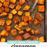 Overhead view of cinnamon roasted sweet potatoes on a baking sheet placed on a white background with text overlay that reads "Vegan + Paleo + Whole30 Cinnamon Rosemary Sweet Potatoes