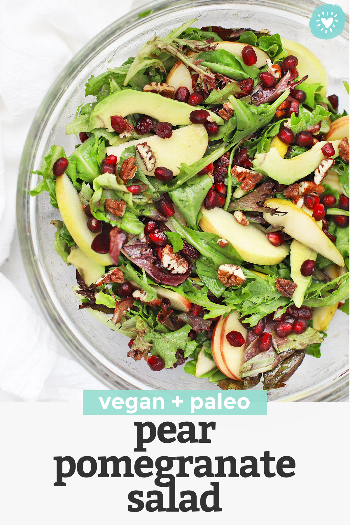Pear Pomegranate Salad  - This pear and pomegranate salad has a beautiful mix of color and flavor. You'll love the simple dressing that ties it all together! (Gluten-Free + Vegan) // Pomegranate Salad Recipe // Side Salad // Holiday salad // Christmas side dish // Thanksgiving side dish #pomegranate #salad #sidedish #sidesalad #paleo #vegan