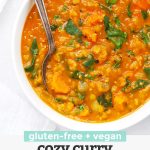 Close up Overhead view of a bowl of curry lentil soup garnished with cilantro with text overlay that reads "Gluten-Free + Vegan Cozy Curry Lentil Soup"