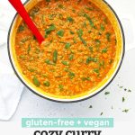 Overhead view of a pot of cozy curry lentil soup with text overlay that reads "Gluten-Free + Vegan Cozy Curry Lentil Soup"
