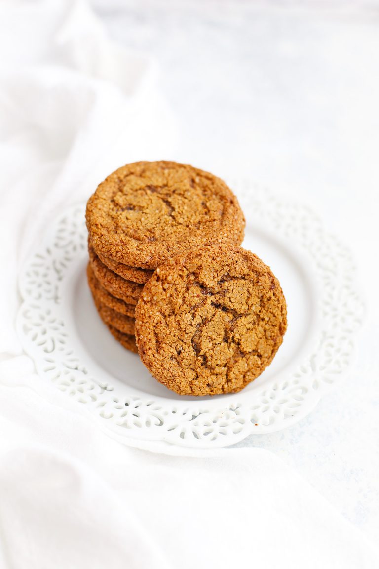 Paleo ginger cookies on a white snowflake plate from One Lovely Life