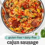 Overhead view of a bowl of Cajun Sausage and Rice Skillet on a white background with text overlay that reads "gluten-free + dairy-free Cajun sausage + rice skillet. An easy one-pan dinner!"