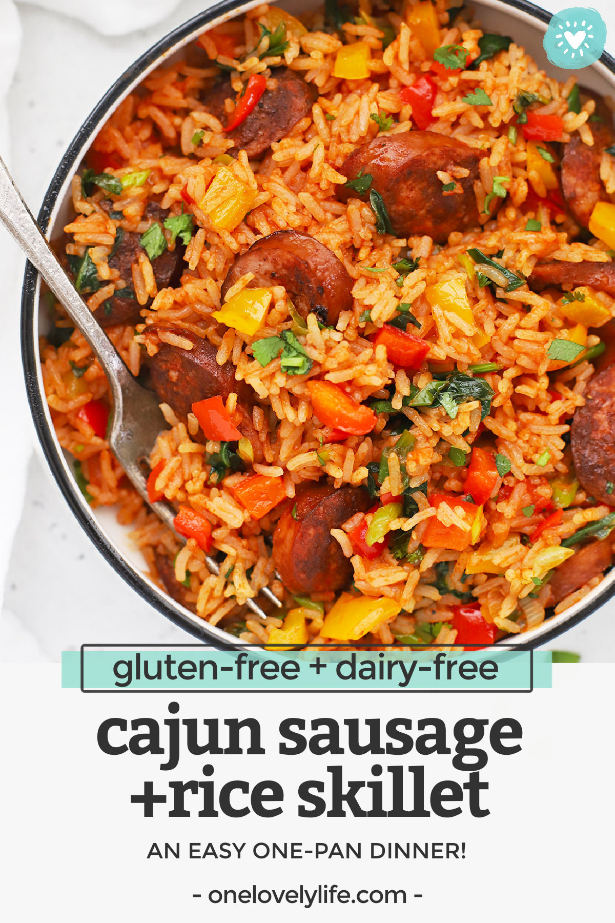 Cajun Sausage and Rice Skillet - This easy one pan dinner comes together in a flash, but packs some serious flavor! A family-friendly dinner that's easy enough to make any night of the week! (Gluten-Free, Dairy-Free) // One-Pan Dinner // Easy Dinner // Cajun Rice // Gluten-Free Dinner #glutenfree #easydinner #rice #onepan #skillet