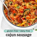 Front view of a bowl of Cajun Sausage and Rice Skillet on a white background with text overlay that reads "gluten-free + dairy-free Cajun sausage + rice skillet. An easy one-pan dinner!"
