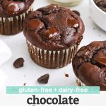Three gluten-free chocolate banana muffins with a bowl of chocolate chips and a bottle of almond milk in the background with text overlay that reads "gluten-free + dairy-free chocolate banana muffins"