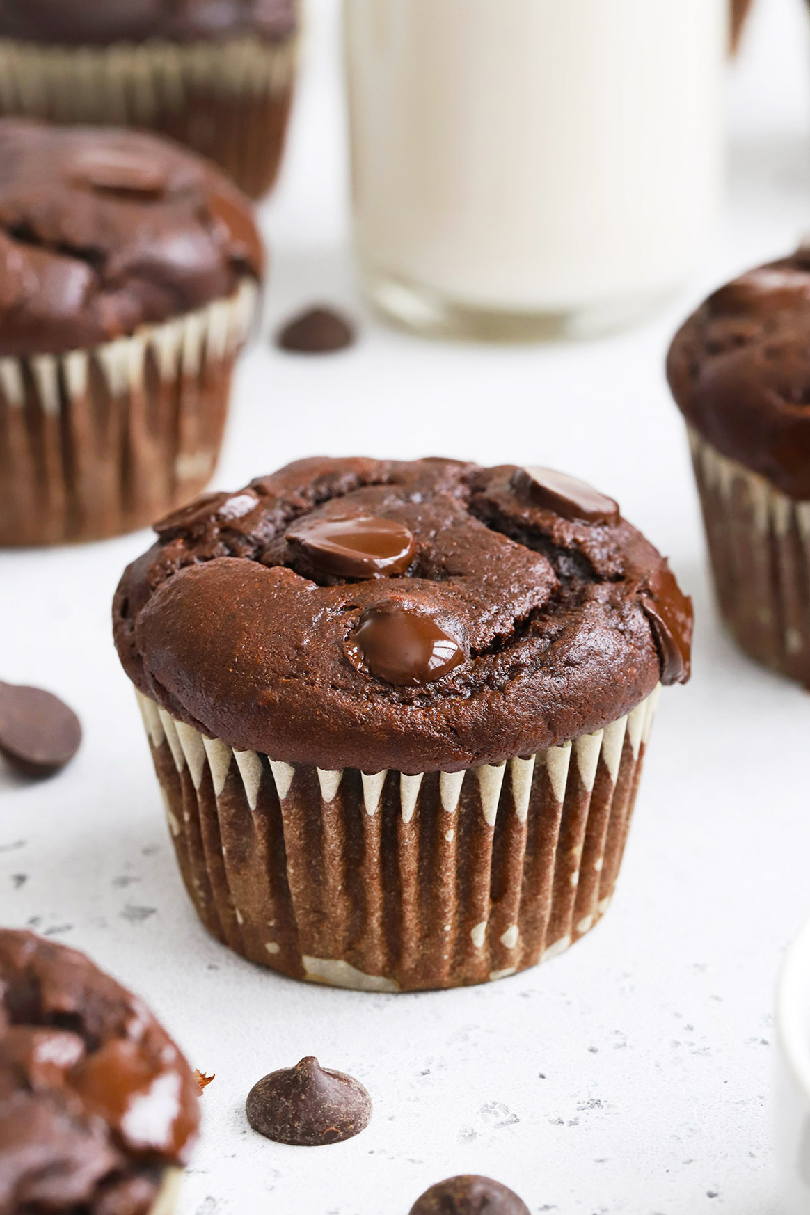 Close up view of a gluten-free chocolate banana muffin with chocolate chips