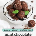 Front view of a bowl of mint chocolate energy bites with a few mint leaves. Text overlay reads "vegan + paleo + gluten-free Mint Chocolate Energy Bites"