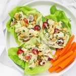 Close up Overhead view of curry chicken salad lettuce wraps on a white background