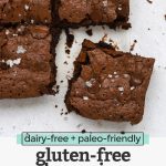 Close up overhead view of gluten-free brownies cut into squares and topped with sea salt with text overlay that reads "dairy-free + paleo-friendly gluten-free brownies"