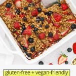 close up Overhead view of a pan of mixed berry baked oatmeal cut into slices with a small spatula with text overlay that reads "gluten-free + vegan-friendly mixed berry baked oatmeal"