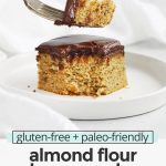 Front view of a fork taking a bite out of a slice of almond flour banana cake on a white plate with text overlay that reads "gluten-free + paleo-friendly almond flour banana cake: light + fluffy + simple"