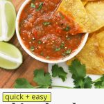 Overhead view of a bowl of chipotle salsa on a wooden board with tortilla chips with text overlay that reads "quick + easy chipotle salsa: smoky + flavorfu; + delicious"