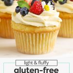 fluffy gluten-free lemon cupcakes topped with lemon frosting and fresh berries