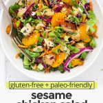 Overhead view of Sesame Chicken Salad in a white bowl on a white background with text overlay that reads "gluten-free + paleo-friendly sesame chicken salad: colorful + fresh + easy"