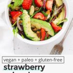 Overhead view of paleo strawberry spinach salad with sweet, tangy dressing