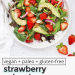 Overhead view of paleo strawberry spinach salad with sweet, tangy dressing