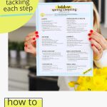 Woman holding up a kitchen cleaning checklist with text overlay that reads "how to deep clean your kitchen"