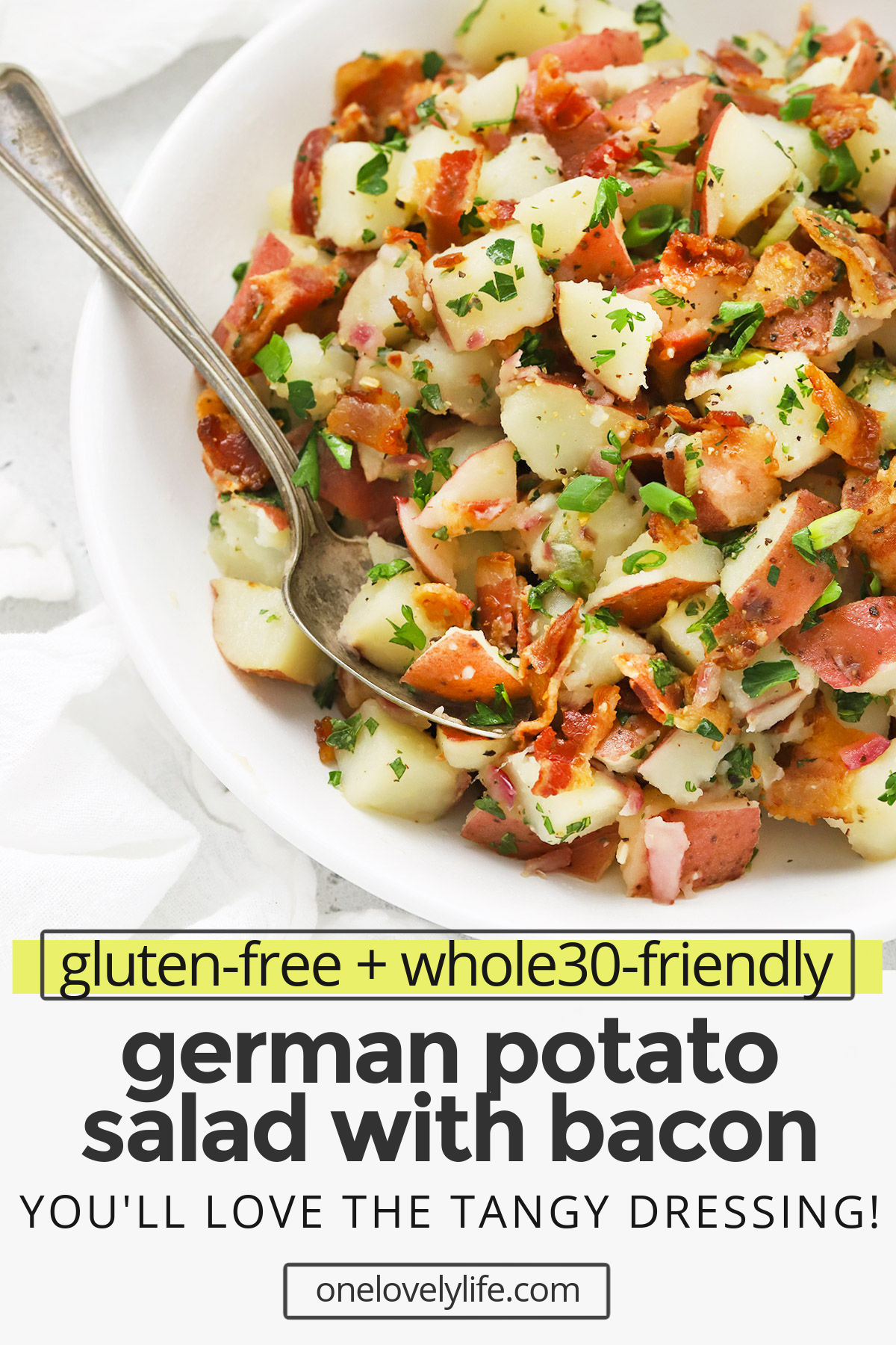 German Potato Salad - A recipe from Michael's side of the family. Tender potatoes tossed with a tangy bacon vinaigrette. It's delicious, savory & perfect all year round! (Gluten-Free, Whole30-Friendly) // Whole30 German Potato Salad // Whole30 Potato Salad // Bacon Potato Salad // Potato Salad with Bacon // Potato Salad recipe #potatosalad #summersalad #oktoberfest #glutenfree #whole30