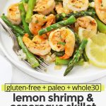 Close up front view of a plate of lemon shrimp and asparagus with cauliflower rice with text overlay that reads "gluten-free + paleo + whole30 lemon shrimp & asparagus skillet: Quick + Easy One-Pan Dinner!"