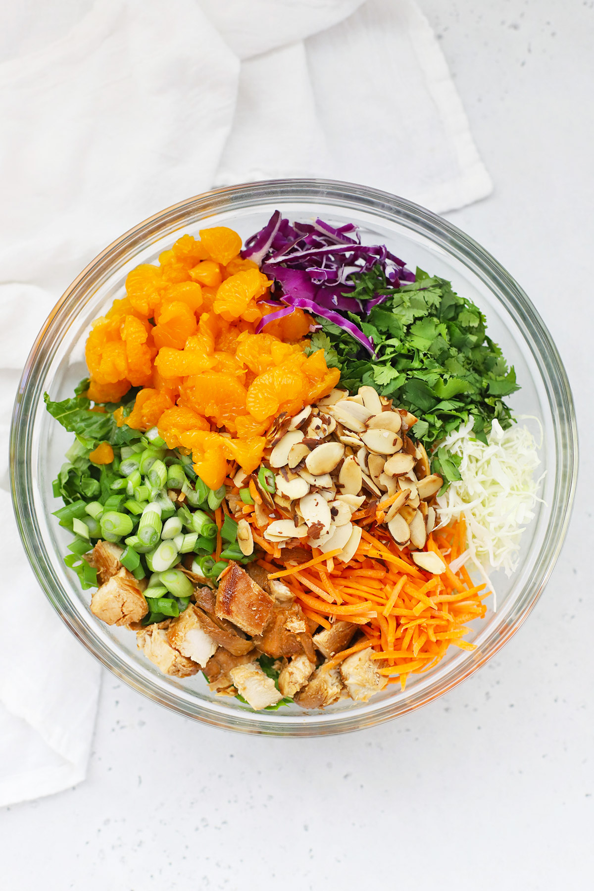 Overhead view of ingredients for Sesame Chicken Salad in a mixing bowl