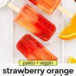 Overhead view of three strawberry orange sunrise popsicles on ice with text overlay that reads "paleo & vegan Strawberry Orange Sunrise Popsicles: Easy + Healthy + Fresh"