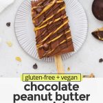 Overhead view of a chocolate peanut butter popsicle drizzled with natural peanut butter and healthy chocolate shell with text overlay that reads "gluten-free + vegan chocolate peanut butter popsicles: creamy + healthy + lovely"