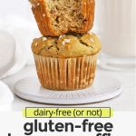 Front view of two gluten-free banana oatmeal muffins stacked on top of each other. The top muffin has a bite taken out of it with text overlay that reads "dairy-free (or not) gluten-free banana muffins: light + fluffy + so easy to make!"