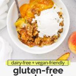 Overhead view of a bowl of gluten-free peach crisp topped with dairy-free vanilla ice cream, slowly melting over the warm crisp with text overlay that reads "dairy-free + vegan-friendly gluten-free peach crisp: try it with a scoop of ice cream!"